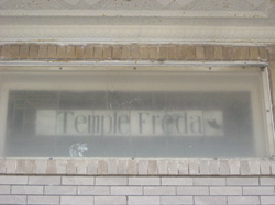 Temple Freda sign in one of the building's windows